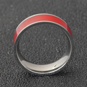 Detailed close-up of 7mm stainless steel ring featuring a vibrant red enamel inlay band