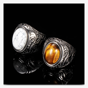 Detailed view of vintage silver rings with turquoise and tiger eye stone inlay
