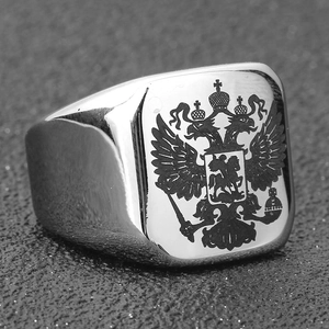 Macro detail of silver stainless steel signet ring with black Russian double-headed eagle