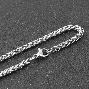 Macro shot of stainless steel spiga chain necklace with secure lobster claw clasp