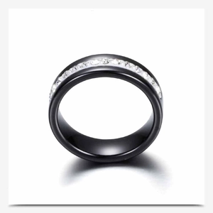 Detail of 6mm black ceramic ring featuring a central row of sparkling white zircons