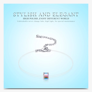 Detailed view of an Austrian crystal cube pendant on a transparent fishing line necklace