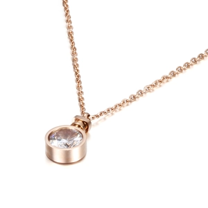 Rose gold perfume bottle necklace with a large round cubic zirconia on a delicate O-chain