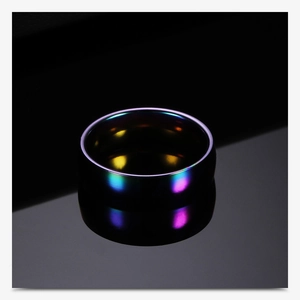 Macro shot of 6mm rainbow titanium steel ring with colorful electroplated finish