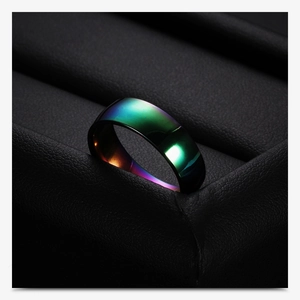 Macro view of 6mm rainbow plated stainless steel ring with vibrant metallic gradient