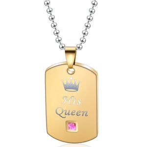 Detail of His Queen gold dog tag necklace with crown motif and pink gemstone inlay