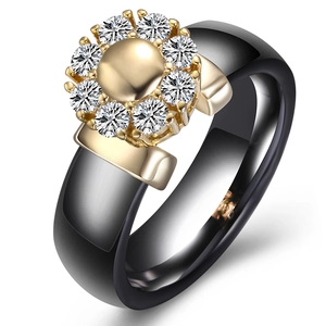 6mm black ceramic ring featuring a golden petal floral design with sparkling crystals