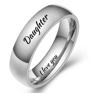 Macro view of polished silver ring with 'Daughter' and 'I love you' engravings
