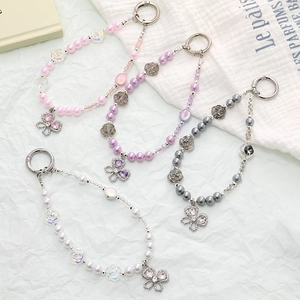 Chic beaded phone strap set with rose beads, pearls, and hollow butterfly pendants