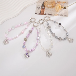 Elegant beaded phone charms with faux pearls, rose beads, and sparkling butterfly pendants