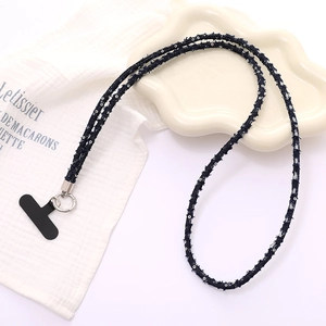 Detail of blue woven phone lanyard with silver beads and metal buckle attachment