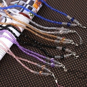 Detailed view of multi-color crystal beaded lanyards with silver lobster clasp hooks