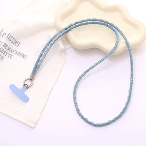 Detail of light blue denim phone lanyard with silver sequins and metal spring ring hook