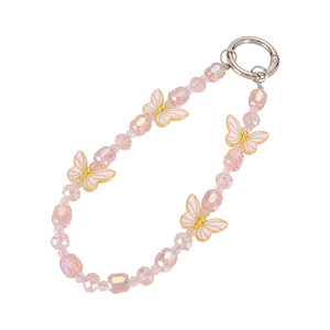 Macro shot of pink crystal beads and gold-edged butterfly charms on a phone chain