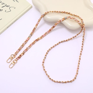 Detail of woven floral pink ribbon with gold chain and lobster clasps for bags