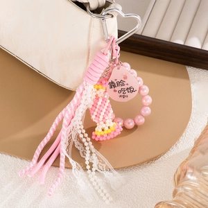 Pink handmade woven beaded bag charm with pearl tassels and heart-shaped metal clip