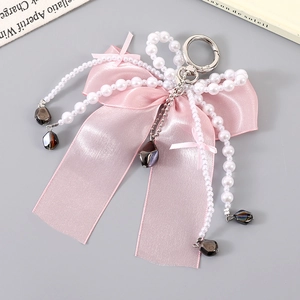 Pink ribbon bow charm with white pearls and silver clasp for bags or mobile phones