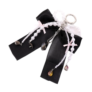Elegant black satin ribbon bow charm with white pearls and heart pendant for handbags