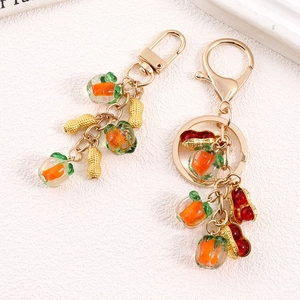 Portachiavi creativo a forma di cachi e arachidi con catena dorata per borse