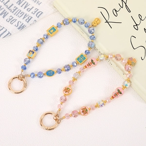 Beaded clover phone charms with lotus and ruyi enamel pendants in blue and pink tones