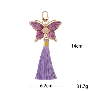 Pendentif papillon fait main en tissu jacquard violet avec de longues glands de soie
