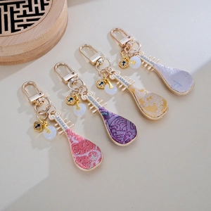 Set of four handmade brocade pipa keychains in vintage Chinese style with metal clasps