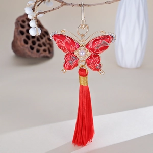 Pendentif papillon fait main en soie avec pompons rouges pour sacs ou téléphones