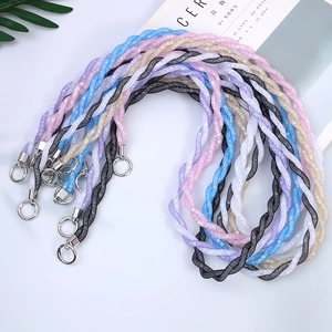 Close-up of sparkling mesh braided phone straps in various colors with silver metal rings