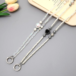 Beaded crossbody phone strap with crystal beads, pearls and heart charms for bags