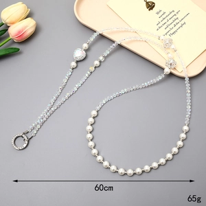 Beaded crossbody phone strap with white pearls and iridescent crystal heart charms