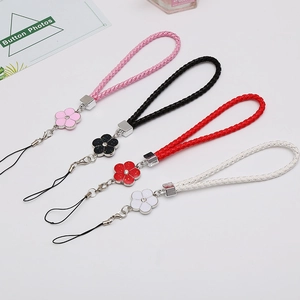 Braided leather phone wrist straps with floral charm accents in multiple colors