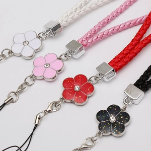 Braided leather phone wrist strap with enamel flower charms in white pink red and black