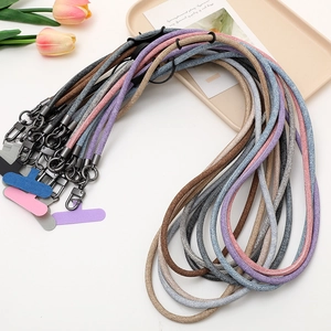 Crossbody denim phone lanyard strap with colorful fabric patches and metal hooks