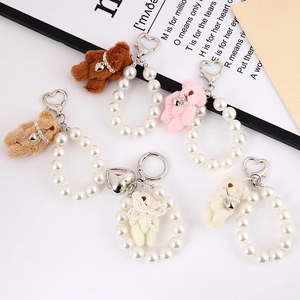 Cute plush bear keychain with white pearl chain and metal heart charm in various colors