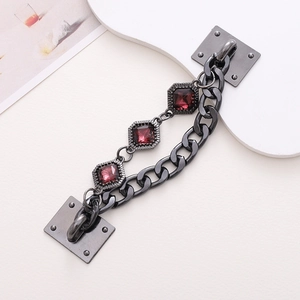 Detail of gunmetal chain with red gemstones for DIY phone cases and handbags
