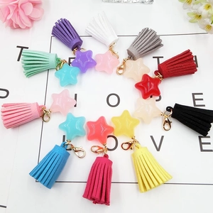 Colorful star-shaped resin charms with suede tassels and gold lobster clasps in 10 colors
