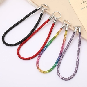 Detail of colorful rhinestone lanyards with silver metal spring rings for phones and keys