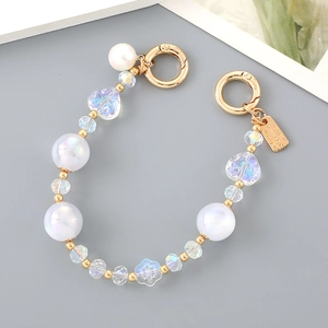 Elegant beaded phone strap with crystal hearts and colorful pearls on a gray background
