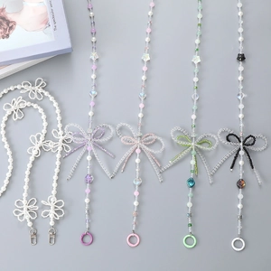 Charming beaded phone lanyards with crystal bows in pearl white, purple, and pink