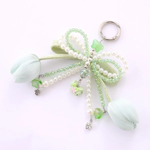 Green silk bow keychain with tulip flower charms, pearls, and crystal bead accents