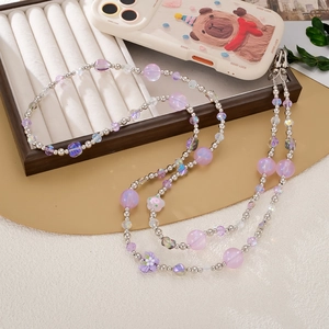 Pastel beaded crossbody phone strap with purple floral charm and silver metal clasps