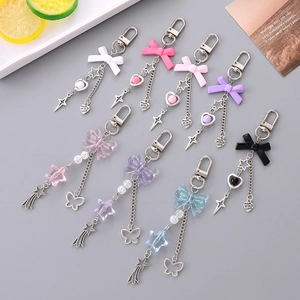 Sweet bow and star keychains in various pastel colors with metallic lobster clasps