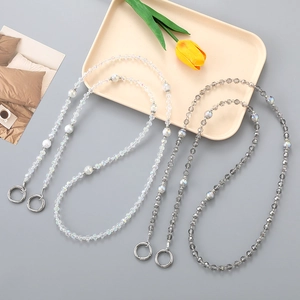 Detail of colorful faceted crystal beads chain with silver round spring clasps for bags