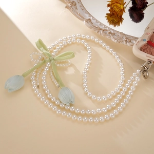 Elegant tulip pearl phone strap with a green ribbon bow and blue flower pendants