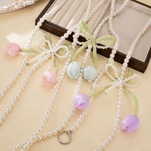 Tulip pearl phone strap crossbody chain with silk flowers and ribbon bow detail