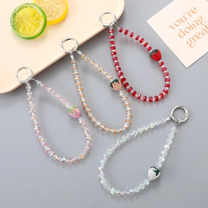 Sparkling strawberry crystal beaded phone straps in four colors with diamond accents