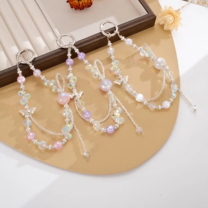 Beaded keychain with butterfly pendant in pink, purple, and white pearlescent colors