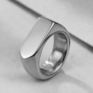 Macro view of 9mm wide polished stainless steel signet ring with rectangle top surface