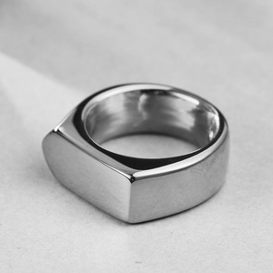 Macro detail of a 9mm polished silver stainless steel signet ring with D-shape flat top