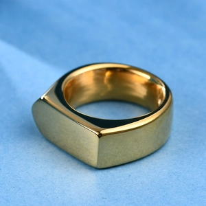 Macro view of a 9mm polished gold rhombic signet ring with a minimalist flat surface